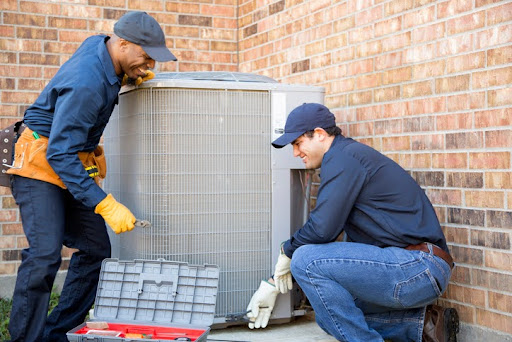 YES! Technicians outside of a home in Las Vegas, installing an air conditioning system.
