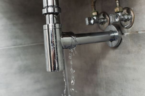 Damaged pipe with leaking water