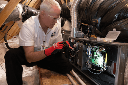 YES! HVAC technician in Las Vegas NV repairing HVAC system in home.