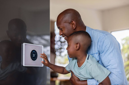 Resident looking at how does a smart thermostat work
